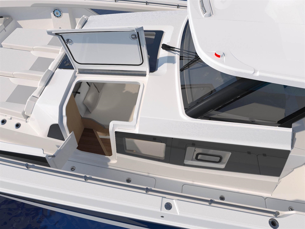 Aerial view of a modern yacht with an open cabin entry, featuring sleek white surfaces and a wooden interior.